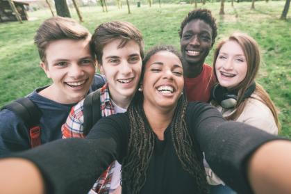 group of teens taking a selfie photo
